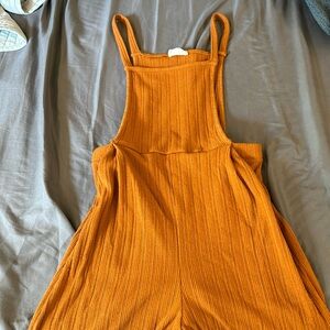 I am selling a burnt orange romper/ overalls! It is a size small!